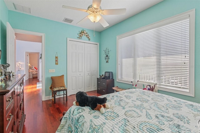 5521 Windward Way, New Port Richey, FL 34652 - bedroom with dark wood finished floors, a closet, and a ceiling fan
