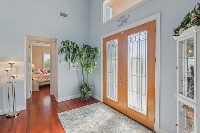 5521 Windward Way, New Port Richey, FL 34652 - foyer entrance with french doors, wood finished floors, and a high ceiling