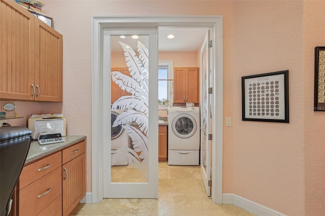 5521 Windward Way, New Port Richey, FL 34652 - laundry area with cabinet space and baseboards
