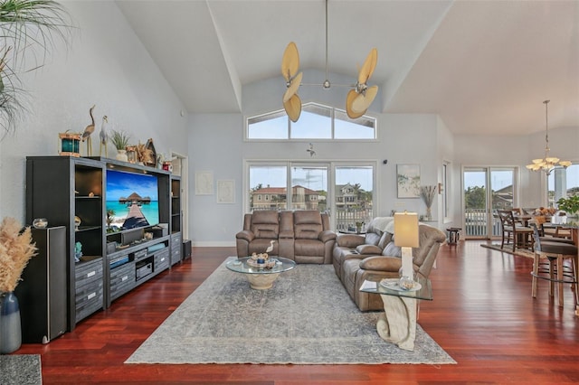 5521 Windward Way, New Port Richey, FL 34652 - living area featuring healthy amount of natural light, dark wood finished floors, a chandelier, and lofted ceiling