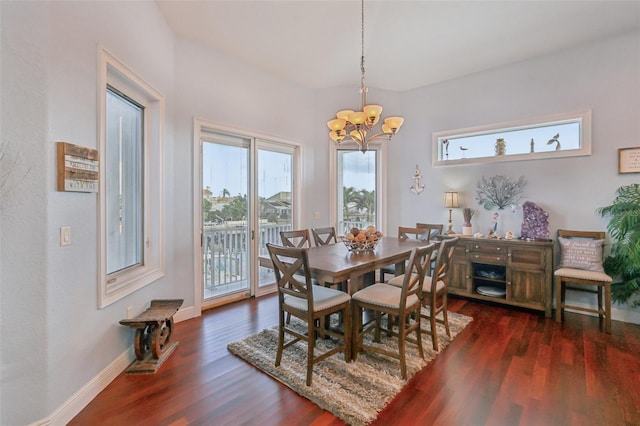 5521 Windward Way, New Port Richey, FL 34652 - dining area with a chandelier and wood finished floors