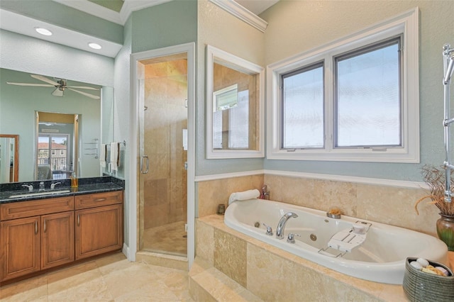 5521 Windward Way, New Port Richey, FL 34652 - bathroom featuring a stall shower, vanity, a jetted tub, healthy amount of natural light, and crown molding