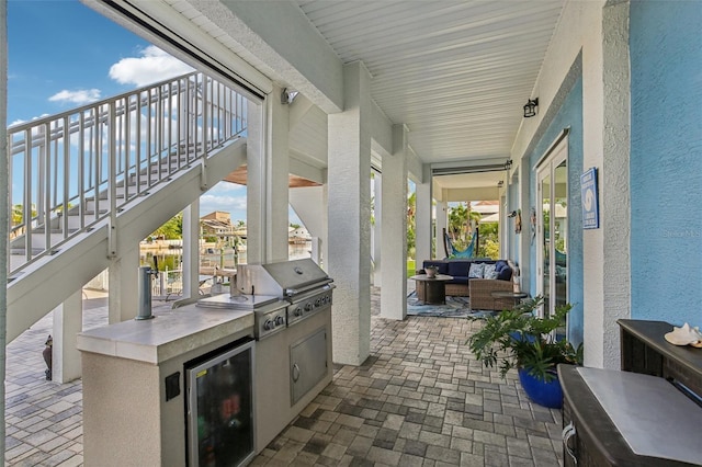 5521 Windward Way, New Port Richey, FL 34652 - view of patio / terrace with stairway, area for grilling, and an outdoor hangout area