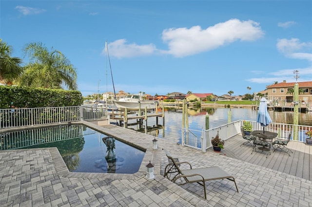 5521 Windward Way, New Port Richey, FL 34652 - dock featuring boat lift, a water view, and outdoor dining area