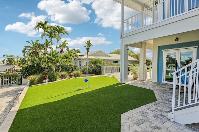 5521 Windward Way, New Port Richey, FL 34652 - view of yard featuring a putting area, a balcony, and a patio