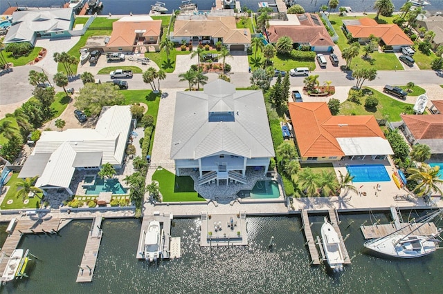 5521 Windward Way, New Port Richey, FL 34652 - aerial view of residential area featuring a pool and a large body of water