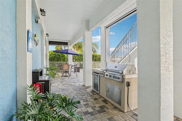 5521 Windward Way, New Port Richey, FL 34652 - view of patio / terrace featuring an outdoor kitchen and outdoor dining area