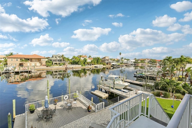 5521 Windward Way, New Port Richey, FL 34652 - dock featuring a water view, outdoor dining area, and a residential view