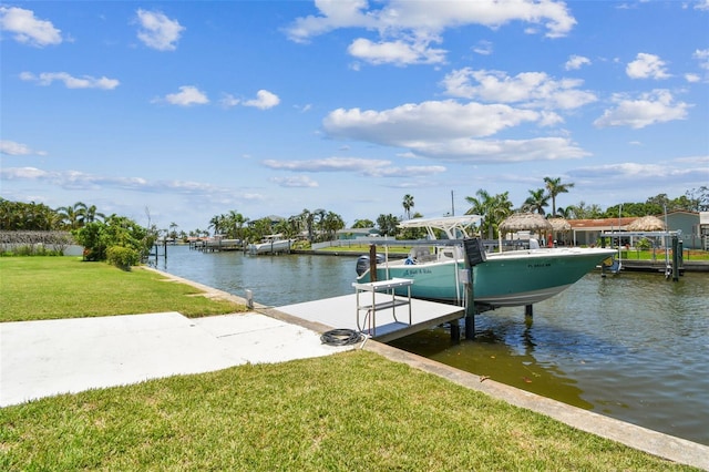11599 Grove St, Seminole, FL 33772 - dock area with boat lift, a water view, and a lawn
