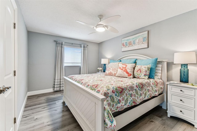 11599 Grove St, Seminole, FL 33772 - bedroom with wood finished floors and a ceiling fan
