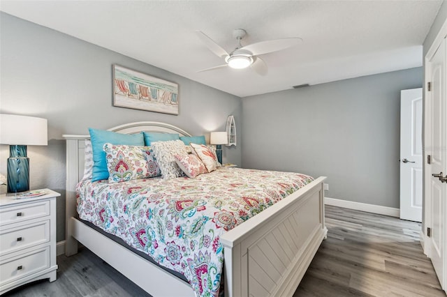 11599 Grove St, Seminole, FL 33772 - bedroom with wood finished floors and ceiling fan