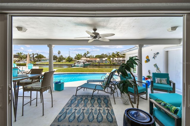 11599 Grove St, Seminole, FL 33772 - outdoor pool with a water view, ceiling fan, and a patio area