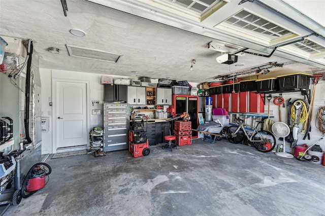 11599 Grove St, Seminole, FL 33772 - garage featuring a garage door opener