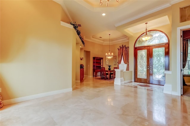 10504 Sabella Dr, Trinity, FL 34655 - foyer with a chandelier, a raised ceiling, crown molding, recessed lighting, and a towering ceiling