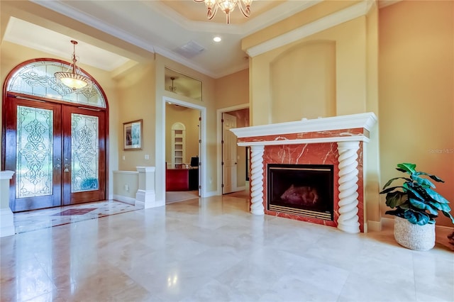 10504 Sabella Dr, Trinity, FL 34655 - entrance foyer featuring crown molding, french doors, a fireplace, a chandelier, and recessed lighting