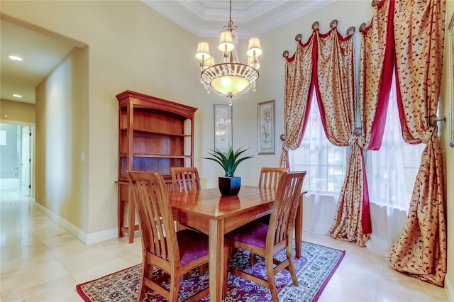 10504 Sabella Dr, Trinity, FL 34655 - dining area featuring a chandelier, crown molding, and a towering ceiling