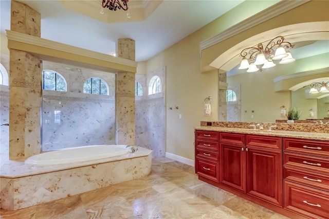 10504 Sabella Dr, Trinity, FL 34655 - full bathroom featuring vanity, a garden tub, a chandelier, and marble finish floors