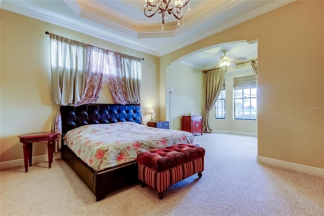 10504 Sabella Dr, Trinity, FL 34655 - carpeted bedroom featuring ornamental molding, a tray ceiling, a chandelier, and arched walkways
