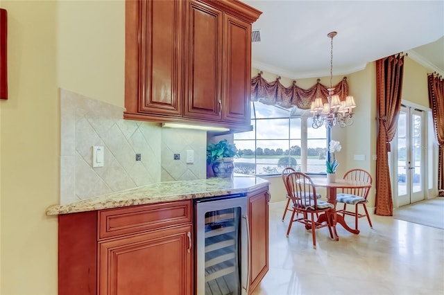 10504 Sabella Dr, Trinity, FL 34655 - indoor bar featuring wine cooler, a chandelier, tasteful backsplash, ornamental molding, and pendant lighting