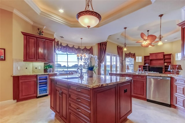 10504 Sabella Dr, Trinity, FL 34655 - kitchen with stainless steel dishwasher, beverage cooler, a tray ceiling, dark brown cabinets, and ornamental molding