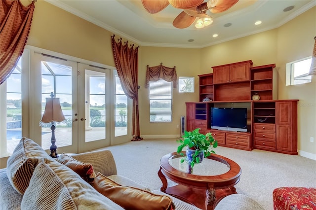 10504 Sabella Dr, Trinity, FL 34655 - living area featuring light colored carpet, french doors, crown molding, a ceiling fan, and a tray ceiling