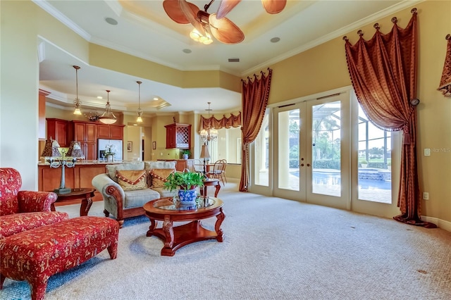 10504 Sabella Dr, Trinity, FL 34655 - living room featuring french doors, crown molding, a raised ceiling, carpet flooring, and ceiling fan