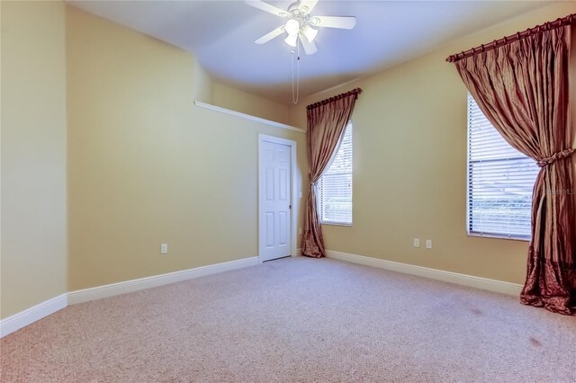 10504 Sabella Dr, Trinity, FL 34655 - empty room with light carpet and ceiling fan