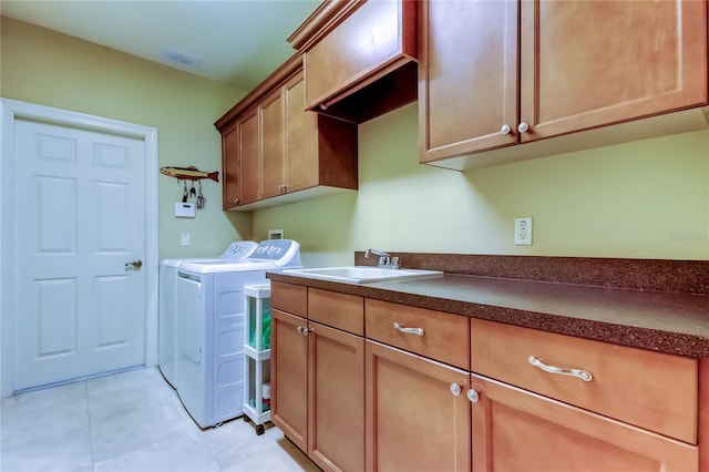 10504 Sabella Dr, Trinity, FL 34655 - laundry area with independent washer and dryer, cabinet space, and light tile patterned flooring
