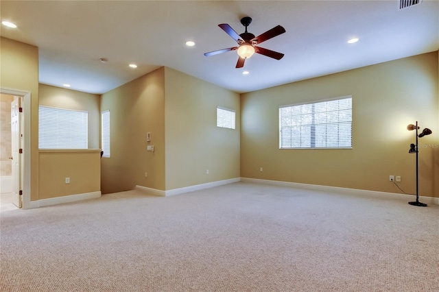 10504 Sabella Dr, Trinity, FL 34655 - empty room featuring light colored carpet, a ceiling fan, and recessed lighting