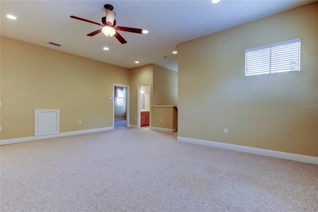 10504 Sabella Dr, Trinity, FL 34655 - empty room featuring light carpet, a ceiling fan, recessed lighting, and plenty of natural light