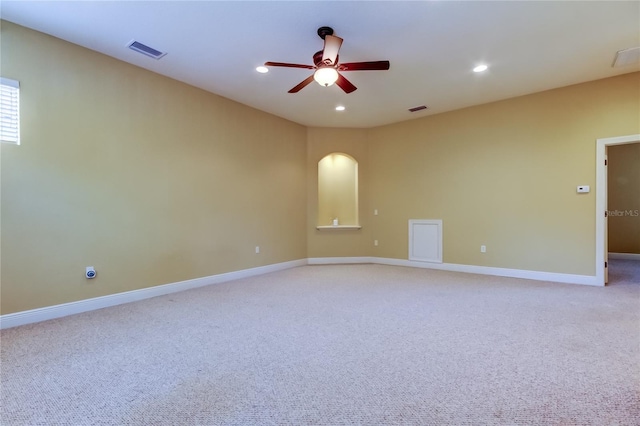 10504 Sabella Dr, Trinity, FL 34655 - empty room with ceiling fan, light colored carpet, arched walkways, and recessed lighting