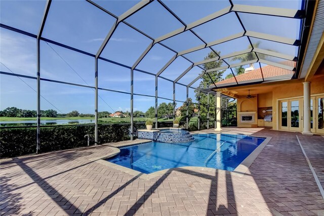 10504 Sabella Dr, Trinity, FL 34655 - view of swimming pool with a pool with connected hot tub, ceiling fan, french doors, and a patio area