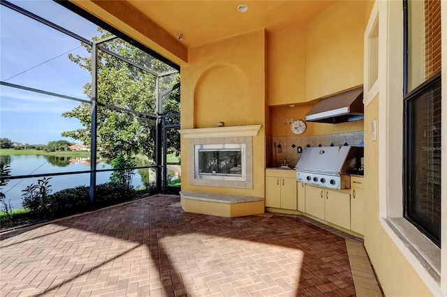 10504 Sabella Dr, Trinity, FL 34655 - view of patio with glass enclosure, an outdoor kitchen, and a water view