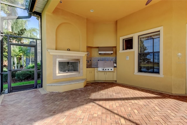10504 Sabella Dr, Trinity, FL 34655 - unfurnished living room featuring brick flooring and a tiled fireplace