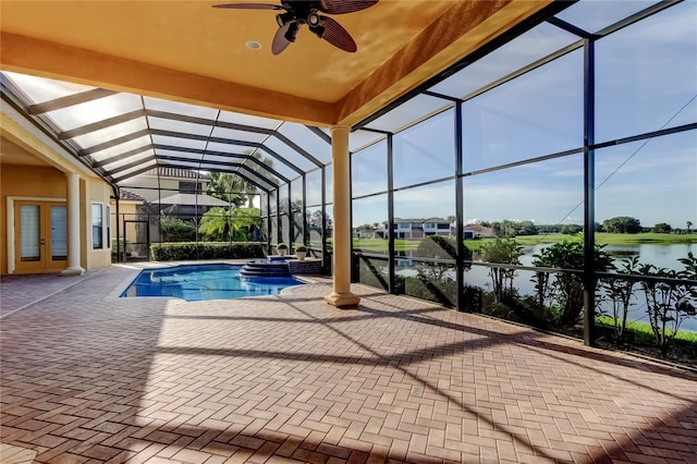 10504 Sabella Dr, Trinity, FL 34655 - view of swimming pool featuring french doors, a pool with connected hot tub, a patio, ceiling fan, and a water view