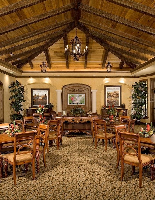 10504 Sabella Dr, Trinity, FL 34655 - carpeted dining space featuring high vaulted ceiling, a chandelier, a wood ceiling with exposed beams, and decorative columns