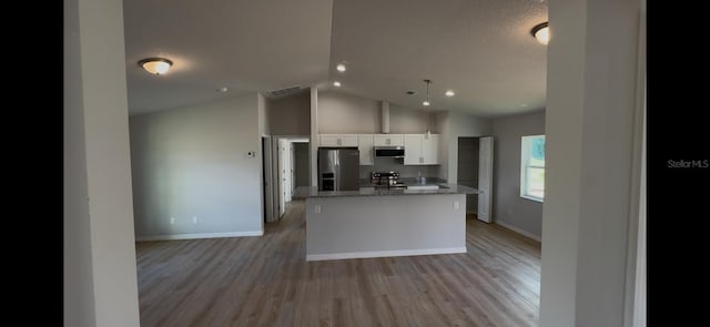 4251 E Walker St, Inverness, FL 34453 - kitchen with appliances with stainless steel finishes, white cabinetry, light wood-style flooring, light stone countertops, and a center island with sink