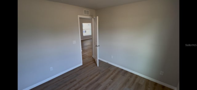 4251 E Walker St, Inverness, FL 34453 - unfurnished room featuring wood finished floors and baseboards