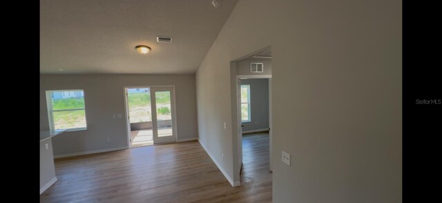 4251 E Walker St, Inverness, FL 34453 - empty room with light wood-style flooring and a smoke detector