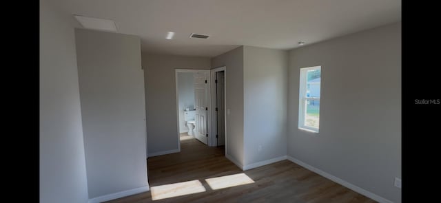 4251 E Walker St, Inverness, FL 34453 - unfurnished bedroom featuring wood finished floors and baseboards