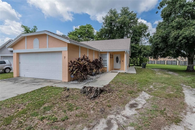1100 Lowry Ave Unit 7, Lakeland, FL 33801 - view of front of home with stucco siding, a garage, and concrete driveway