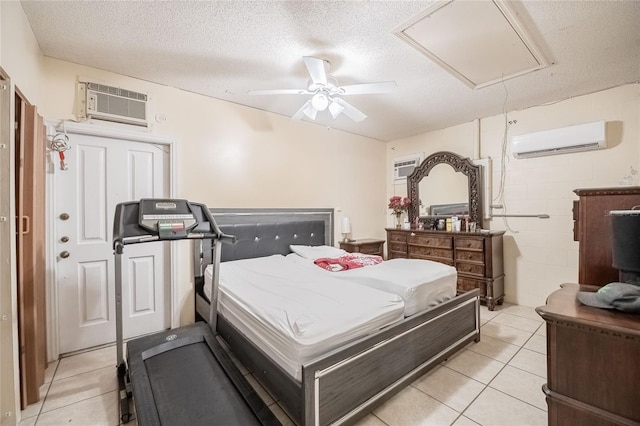 1100 Lowry Ave Unit 7, Lakeland, FL 33801 - bedroom with a wall mounted AC, attic access, a wall unit AC, light tile patterned floors, and a textured ceiling