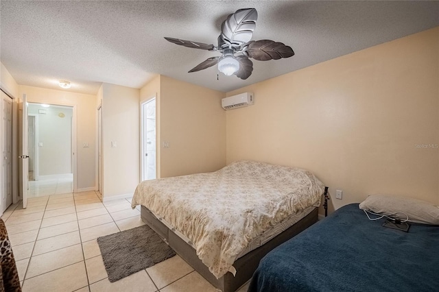 1100 Lowry Ave Unit 7, Lakeland, FL 33801 - bedroom with a wall mounted AC, light tile patterned floors, a ceiling fan, and a textured ceiling