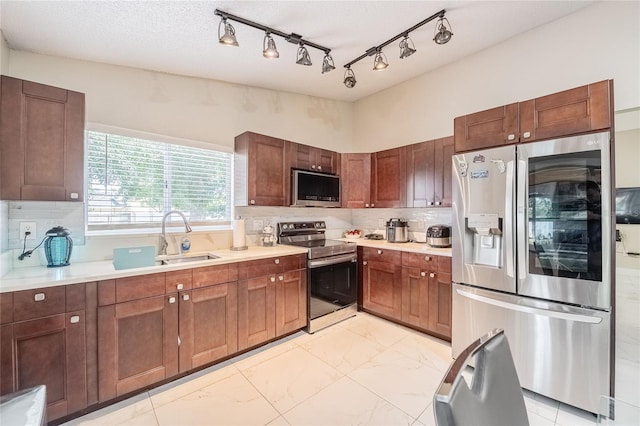 1100 Lowry Ave Unit 7, Lakeland, FL 33801 - kitchen featuring stainless steel appliances, light marble finish floors, light countertops, and tasteful backsplash