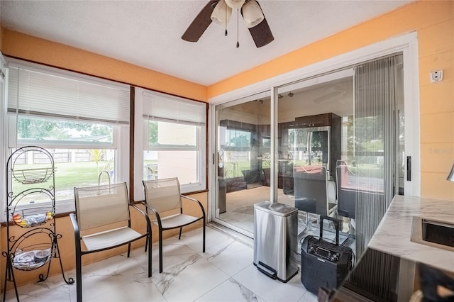 1100 Lowry Ave Unit 7, Lakeland, FL 33801 - sunroom / solarium with marble finish floors and a ceiling fan