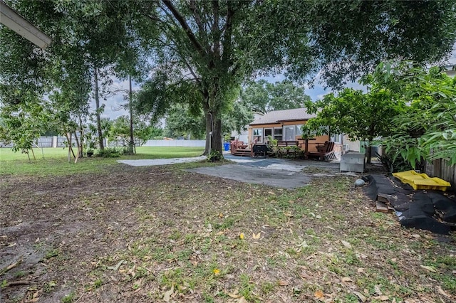 1100 Lowry Ave Unit 7, Lakeland, FL 33801 - view of green lawn with a deck and a patio
