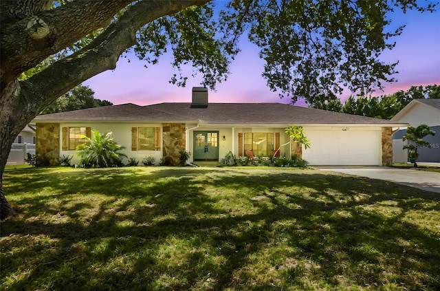 2004 Varner Cir, Winter Haven, FL 33884 - single story home featuring a chimney, driveway, stone siding, a garage, and a front yard