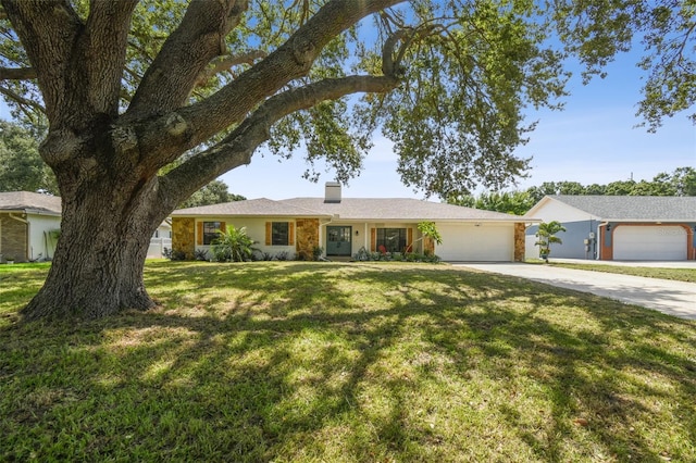 2004 Varner Cir, Winter Haven, FL 33884 - single story home featuring driveway, a chimney, an attached garage, and a front lawn