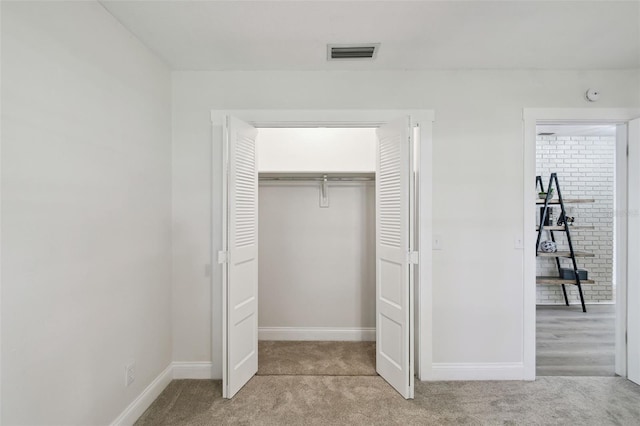 2004 Varner Cir, Winter Haven, FL 33884 - unfurnished bedroom with light colored carpet and a closet