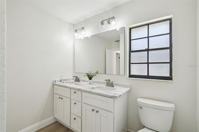 2004 Varner Cir, Winter Haven, FL 33884 - full bathroom featuring double vanity and wood finished floors